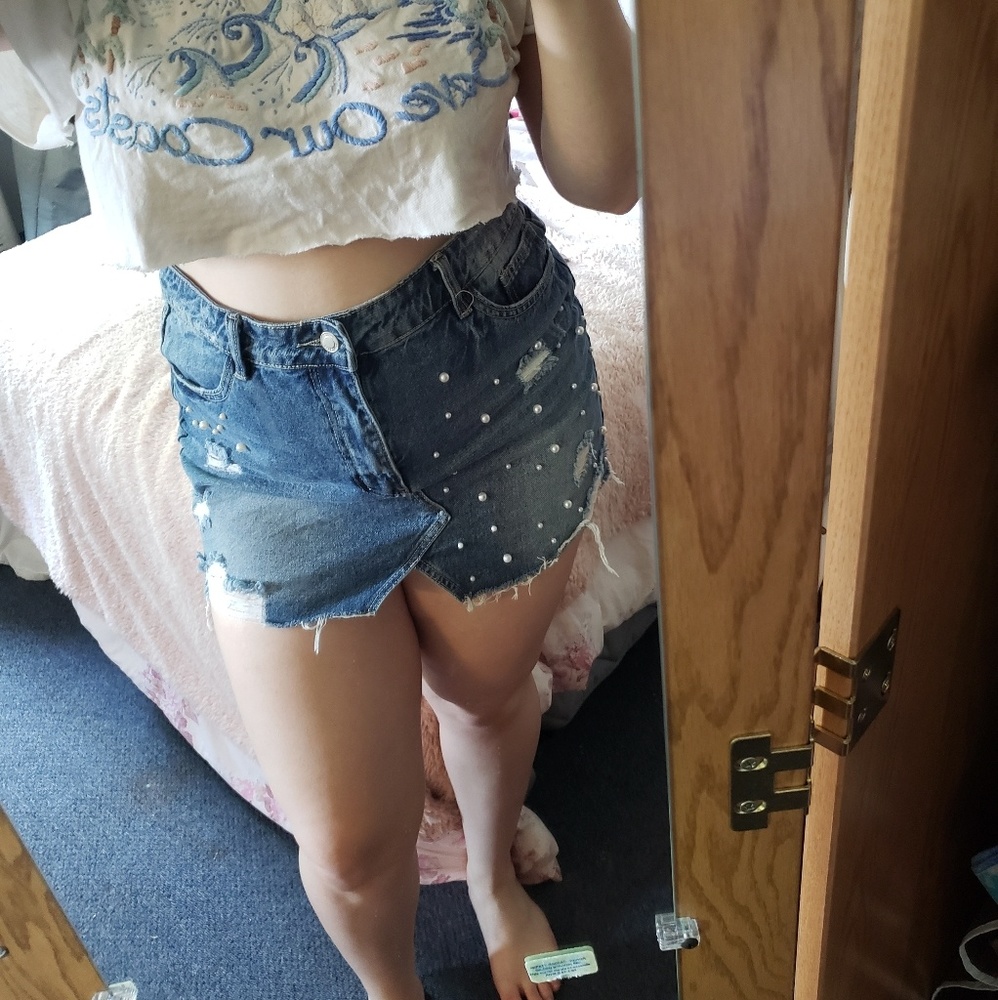 Distressed denim mini skirt